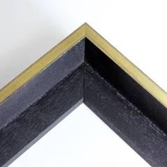 This wooden floater frame comes in a matte black that is accented by a thin metallic gold profile. The gold profile is minorly distressed with thin black lines similar to a gradient. Together the black and gold colouring create a sleek frame appearance that is perfect for a modern look.