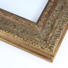 This large vintage frame features highly decorative details. The molding is Gold with hints of bronze, giving it a classic look.